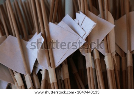 Incense sticks with gold plate sheets in Thai temple