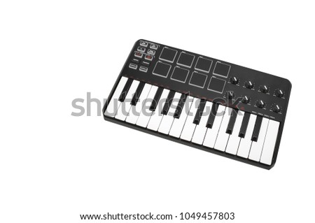 Musical instrument - Sloseup MIDI piano keyboard. It is isolated on a white background