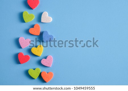 Plain blue background with little heart