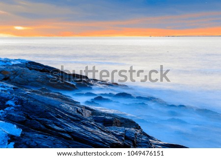 Beautiful sunset on a rocky ocean shore