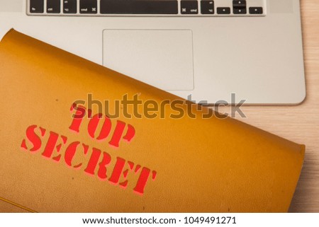 file with confidential data on the corporate desk, top view
