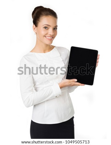 Modern  business woman holds a tablet of white color in hand