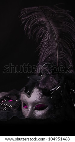 Venetian Mask, against black background Royalty-Free Stock Photo #104951468