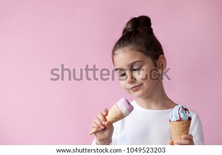 happy little girl eating ice cream 