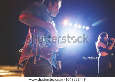 Bass player in rock and roll live group