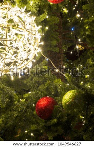 Christmas celebration holiday background. Christmas tree decoration baubles on decorated Christmas tree