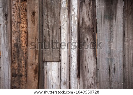 Variety of vertically nailed wooden planks in multi colors background