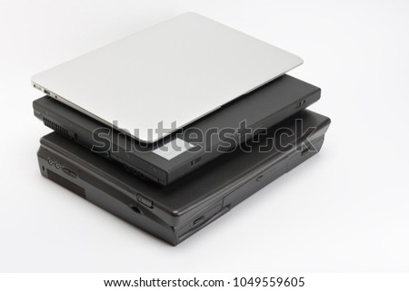 Comparing of laptops, new modern and old laptops, present and past, technology progress isolated on white background.    