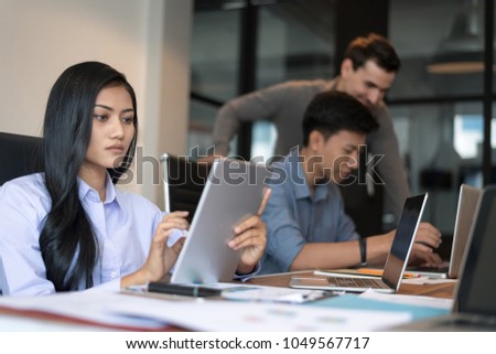 Young business woman is boring. People and crisis concept. Young woman is sitting sad and solving problem in office. Setup studio shooting.