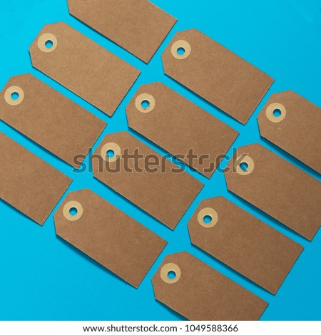 Brown eco label with kraft carton on a blue background. Mockup. Sale theme.