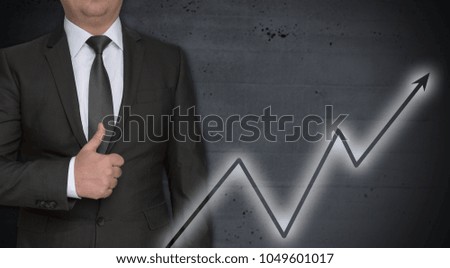 Graph concept and businessman with thumbs up.