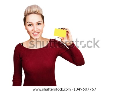 Girl holding plastic card and smiles. Isolated on white background