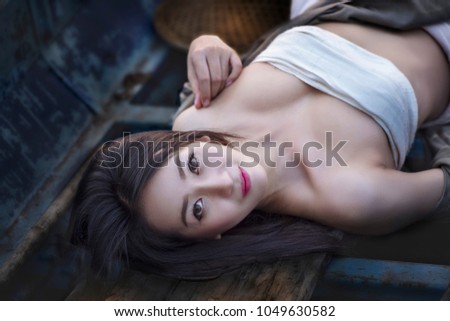 A portrait of a beautiful asian woman smiling brightly at the camera,beautiful happy Asian girl smile and laugh together.