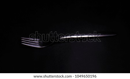 A picture of a fork in low key Light 