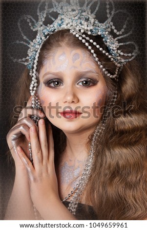close up portrait of beautiful petite princess with professional makeup
