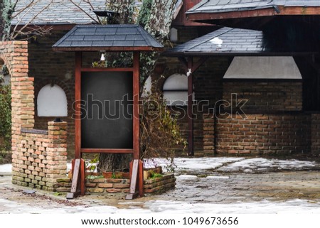 empty space for copy black board on red brick wall texture background