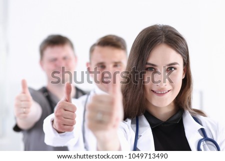 Group of doctor show OK or approval sign with thumb up portrait. High level service, best treatment 911 healthy lifestyle satisfied patient therapeutist consultation physical concept