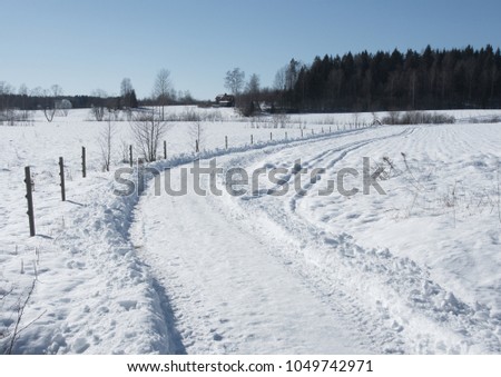 A snowy path sunny winterday.