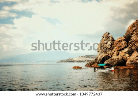 Summer landscape of the sea and mountains, boat in the sea