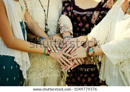 four boho style women from behind outdoors Royalty-Free Stock Photo #1049779376