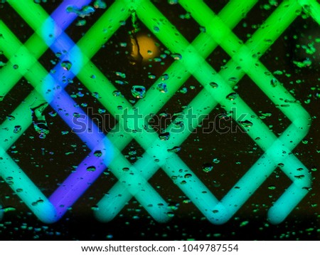 Abstract color neon or led lights background with water drops