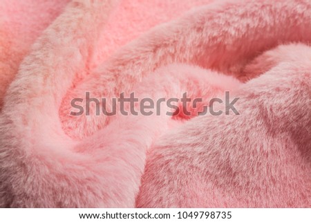 Beautiful abstract art background of detail bright colorful pattern texture shaggy fur with long fibers. Polyester synthetic or natural fluffy plaid. Comfortable home textile. Closeup palette texture