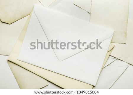 Old envelopes and vintage postcards on white background