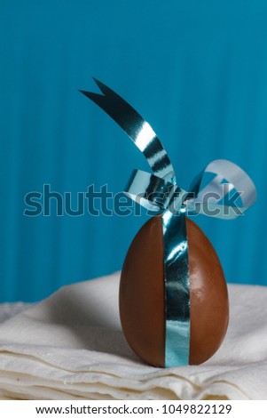 chocolate Easter egg with a ribbon