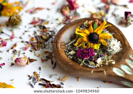 Dried Flowers Essential Oil Amber bottles on white backgrounds