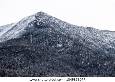 Beautiful mountain terrain covered with snow in White Mountain National Forest in New Hampshire