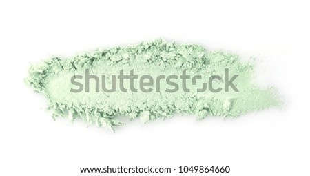 Crushed eye shadow on white background. Professional makeup products