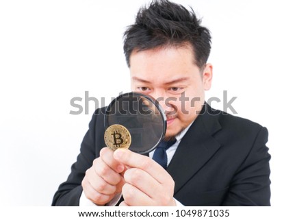 Businessman searching virtual currency 