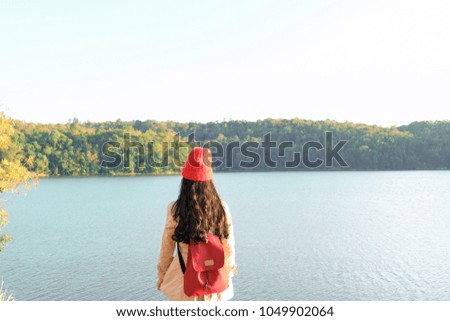 Beautiful girl traveler in nature with camera travel photo of photographer.  