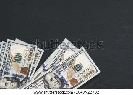 Dollars banknotes on black background.
