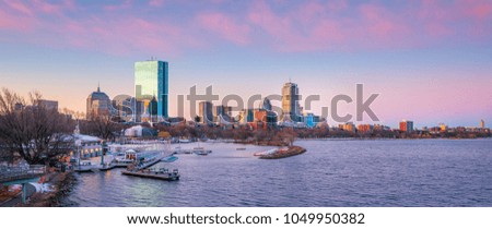 Panorama view of Boston skyline with skyscrapers over water at twilight in United States