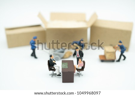 Miniature people: Manager and group of worker loading product to customer around the world with copy space using as background rent warehouse store. business marketing online service concept.