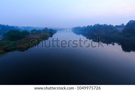 Beautiful misy morning view of periyar river and Sri Sankara bridge from Kalady, Cochin, Kerala, India.