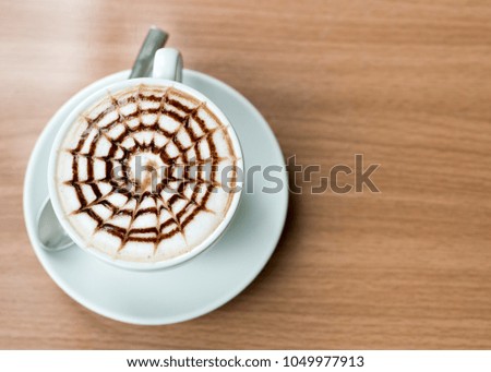 Hot coffee on wooden table