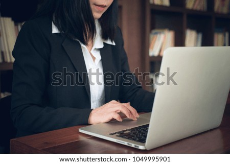 Business woman with notebook in the office
