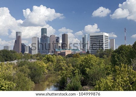 Houston Skyline with a Park and a River in the Foreground.