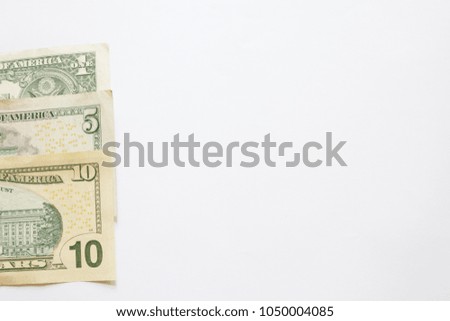 soft focus bank of us dollars on white background for add text space.
