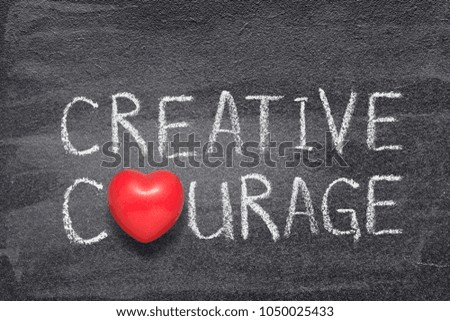 creative courage phrase handwritten on chalkboard with red heart symbol instead of O