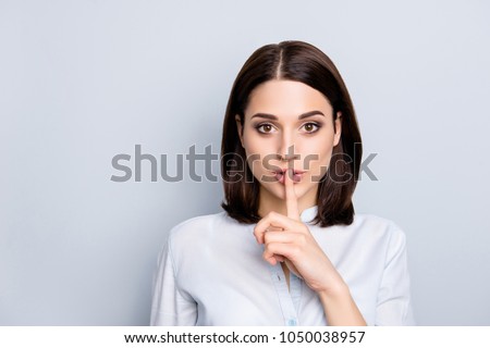 Shh shy sly people person modern concept. Close up portrait of cute lovely attractive uncertain unsure with stylish hairdo entrepreneur making hush gesture isolated on gray background copy-space Royalty-Free Stock Photo #1050038957