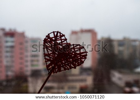 red heart on window background