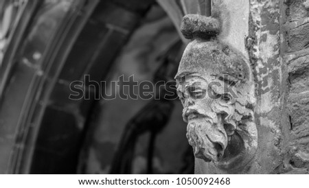 Corbel Head on St John Church in Bristol D, Architecture Details, black and white shallow depth of field horizontal photography