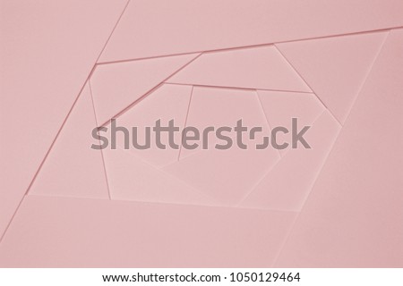 Abstract geometric background in light pastel tones from sheets of thick pale pink paper, cardboard. Suitable as design element, separate project for your project, cover for website. Horizontal.