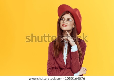 a young lady in a red hat and jacket                            