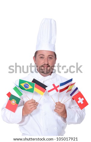 Chef holding variety of national flags