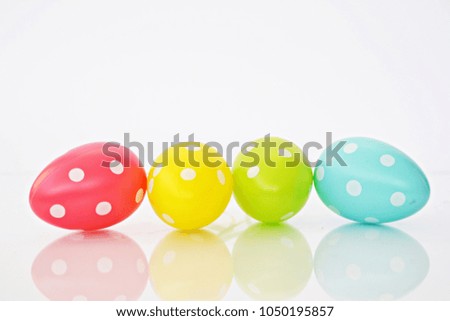 Dotted easter eggs in front of white background