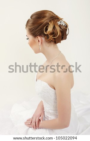 Closeup picture of a bridal hairstyle on white background